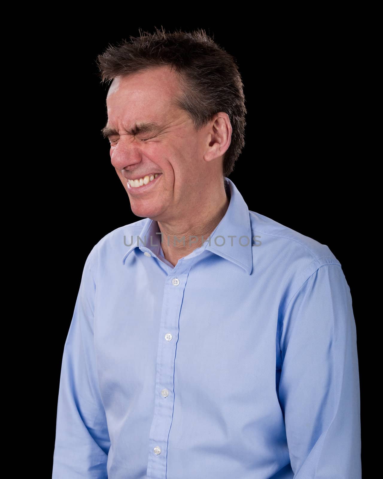 Middle Age Business Man with Eyes Screwed up in Horrified Reaction Black Background