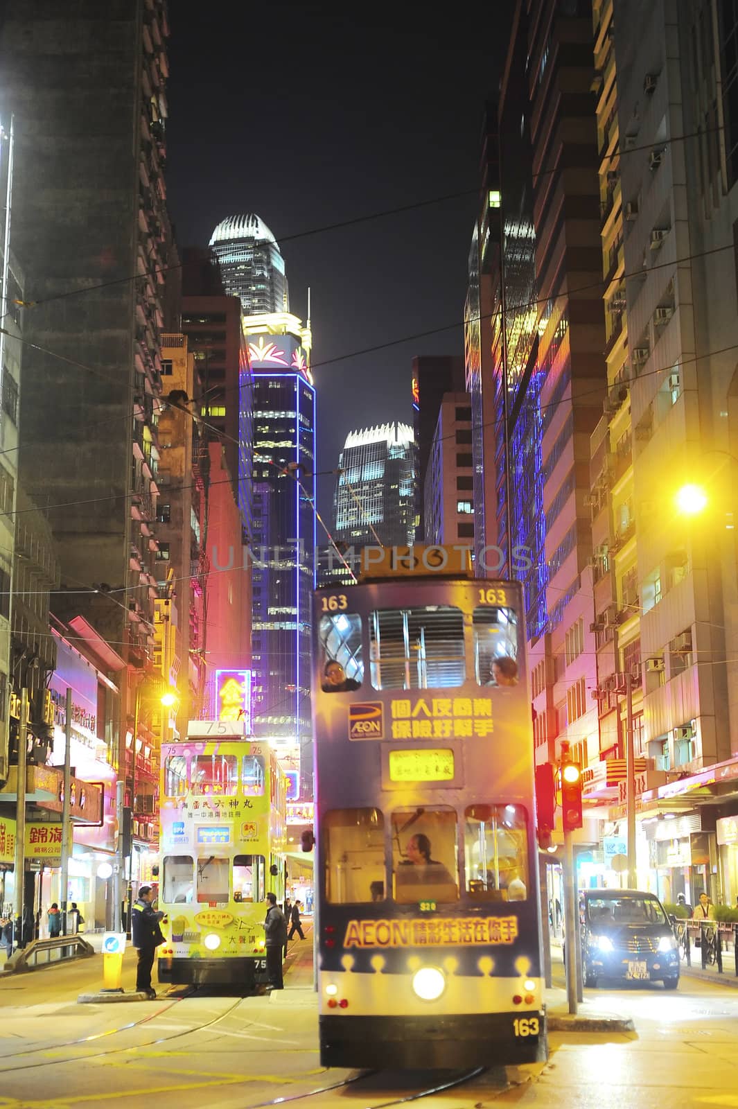 Hong Kong -  January 14, 2013: Trams on the street of Hong Kong. Trams in Hong Kong have not only been a form of transport for over 100 years, but also a major tourist attraction.