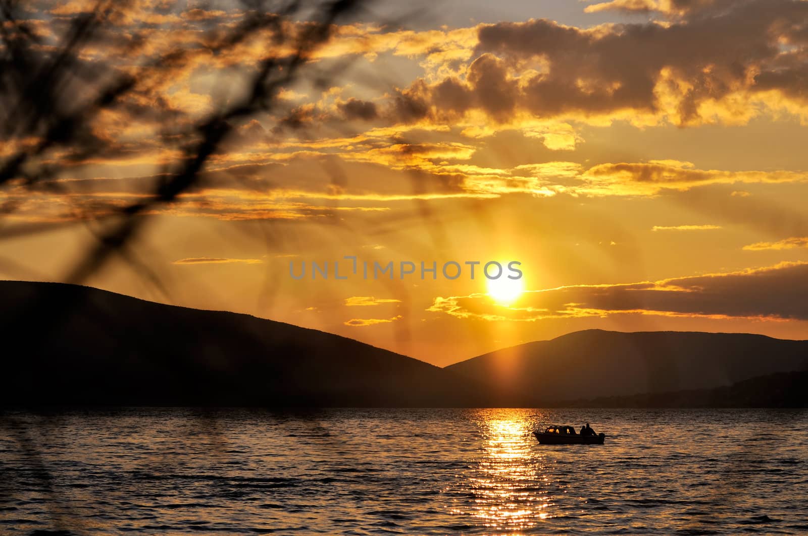 Sunset in the bay with fishing boat