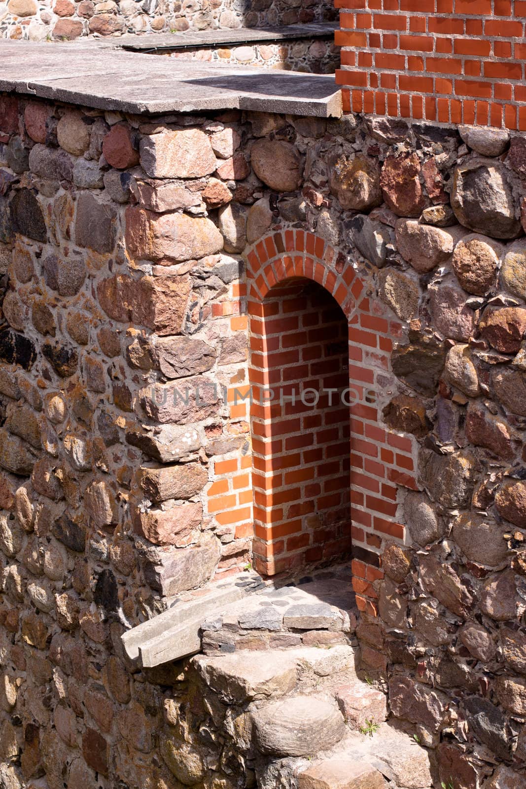 A doorway in red tower of Trakaj castle in Lithuania
