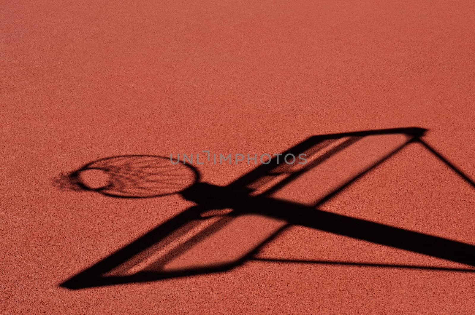 Basket and board shadow at outdoor basketball court