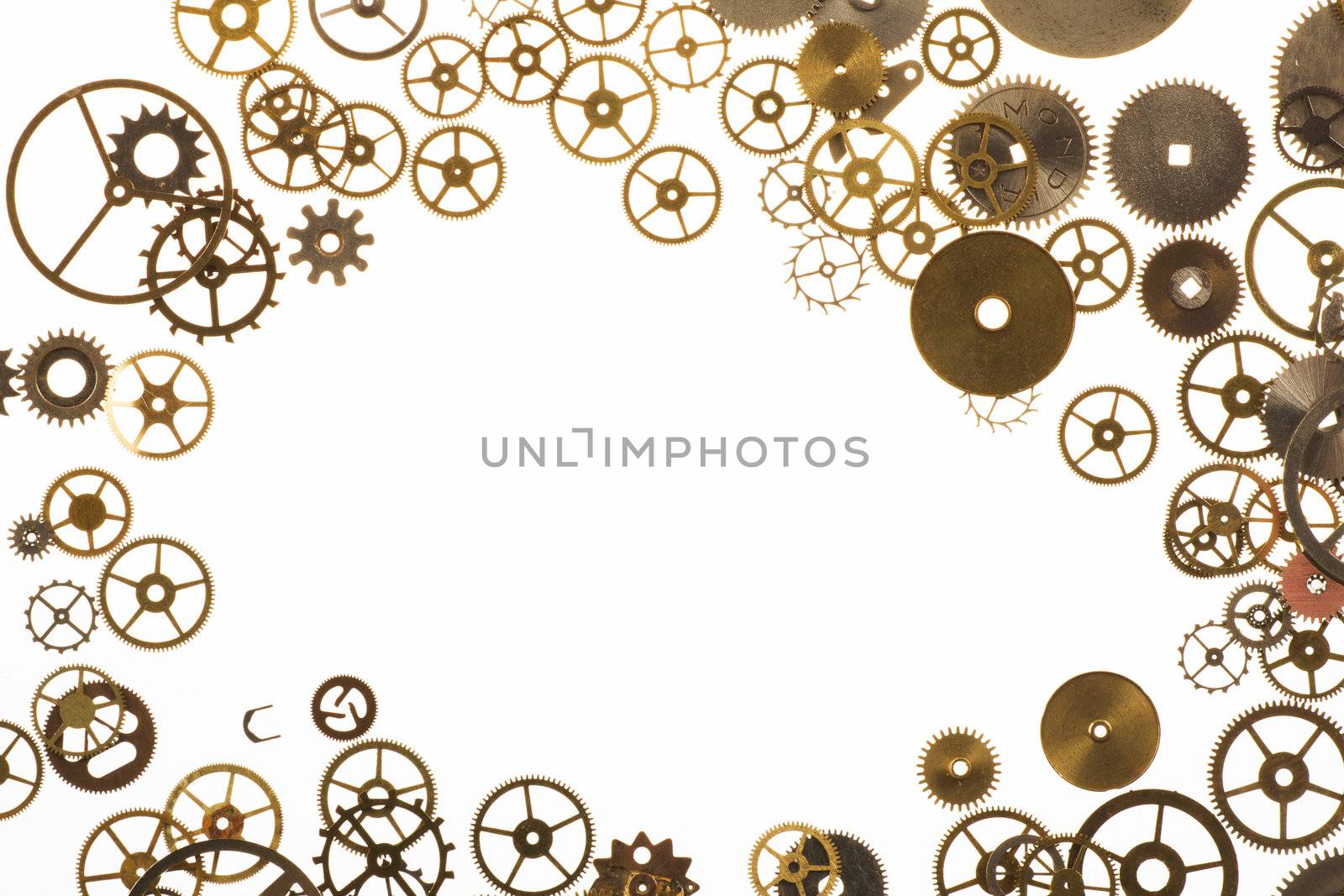 Watch cogs on white forming a frame with copy space in center