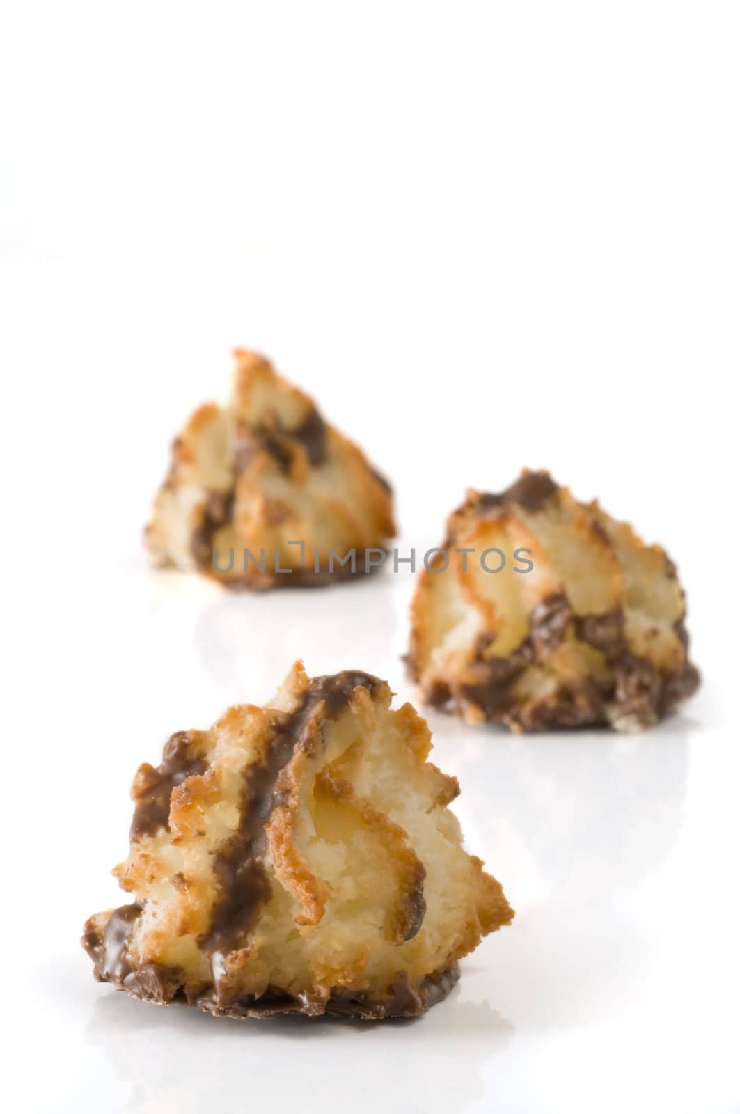 Three macaroon with selective focus on the foreground one all isolated on white background