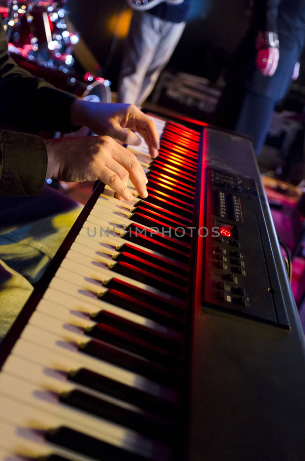Selective focus on the hands on the keyboard at a blues festival
