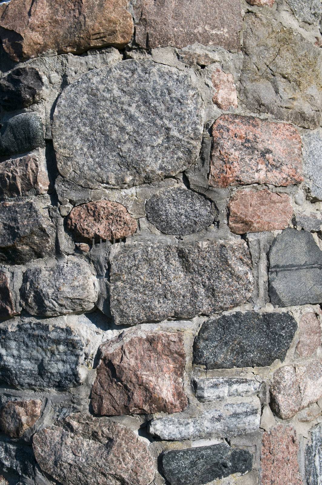 Stone background of a stone foundation from a century style turret with copy space 