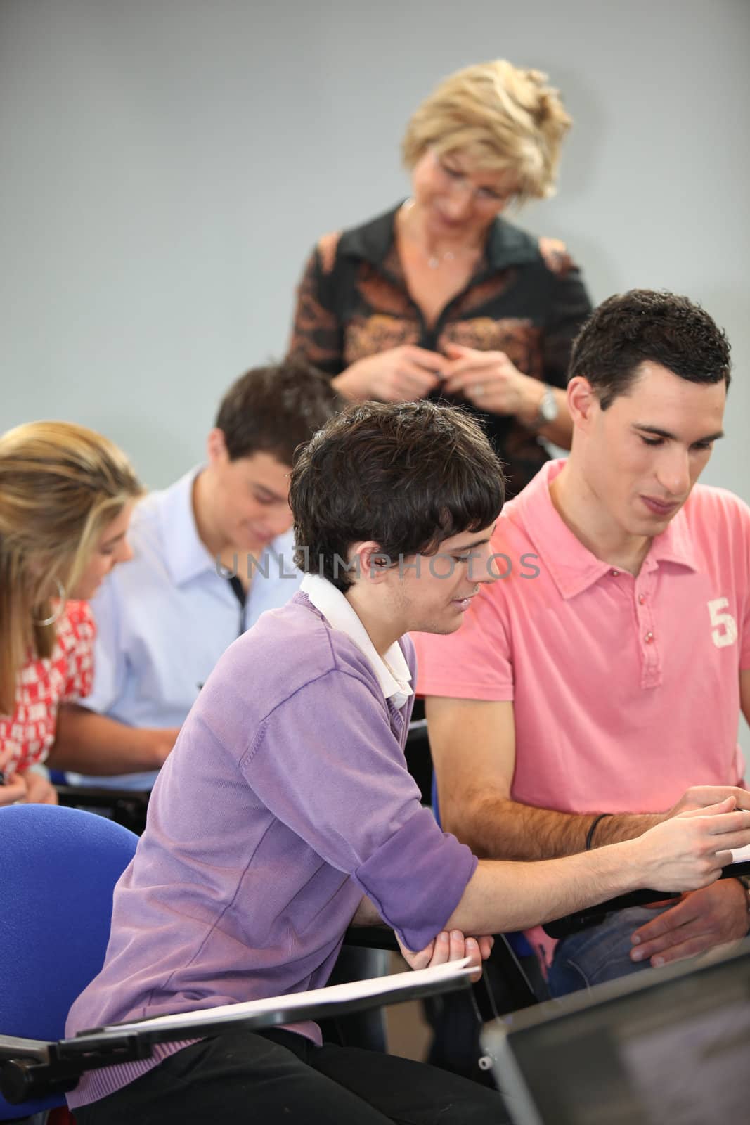 College students in class by phovoir