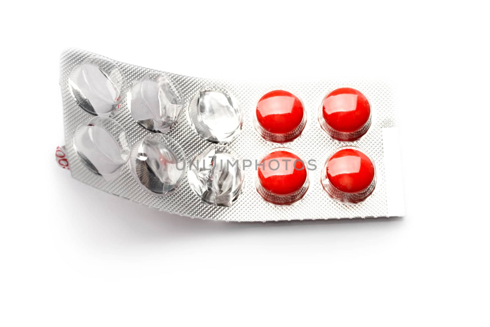Pack of pills isolated on white by Garsya