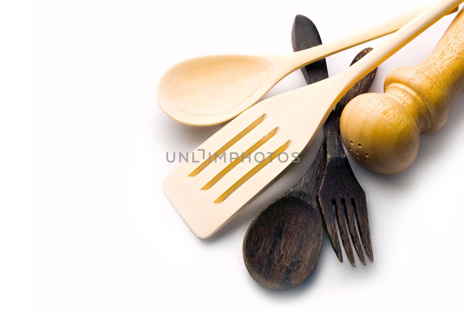 Wooden kitchen-ware isolated on white by Garsya