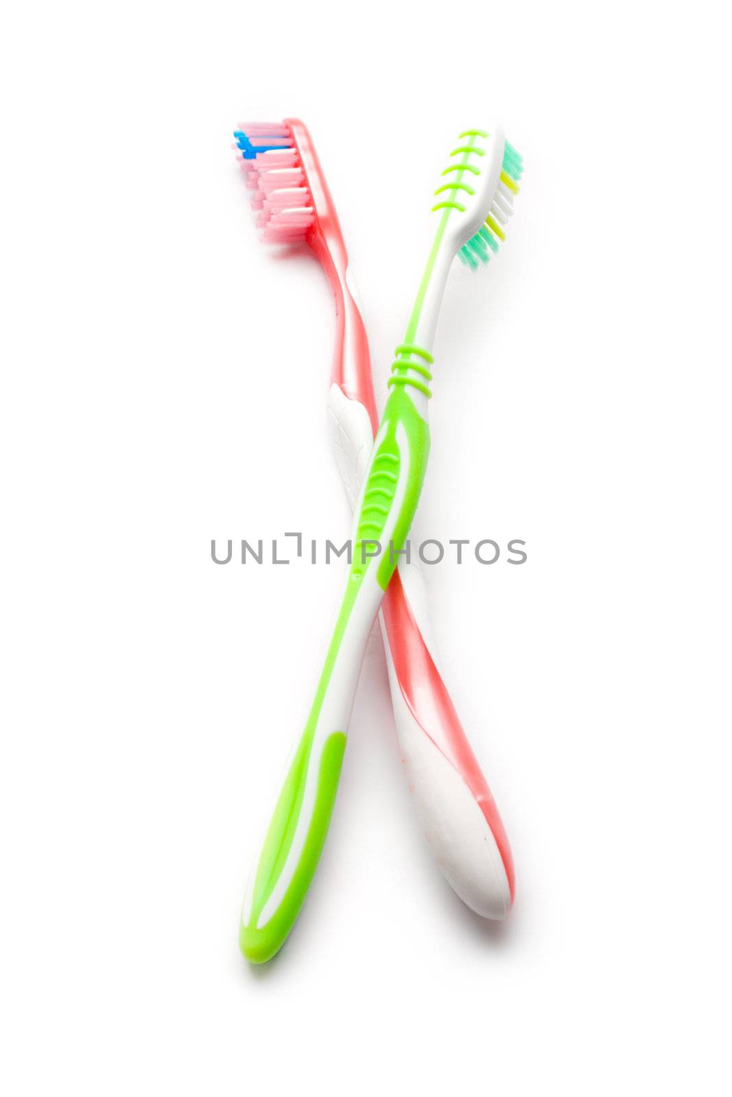 Toothbrushes isolated on white by Garsya