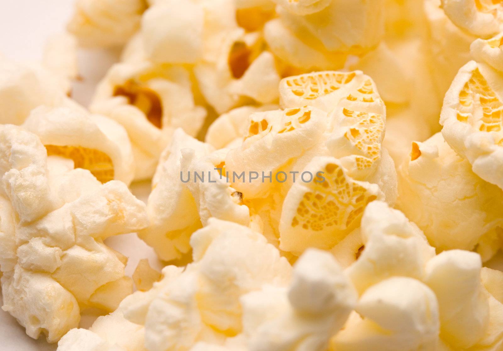 Popcorn isolated on white by Garsya