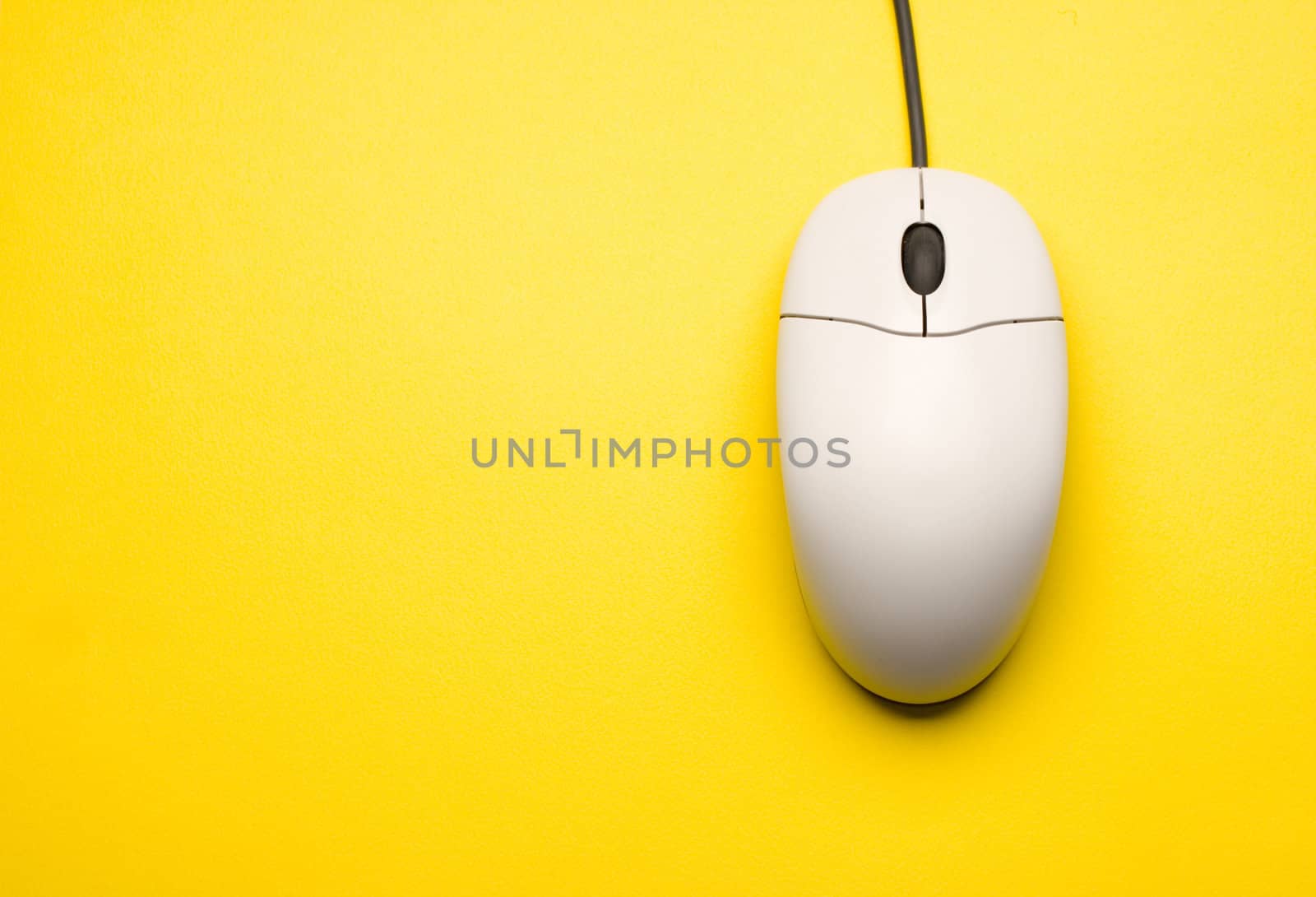 Computer mouse isolated on the yellow background