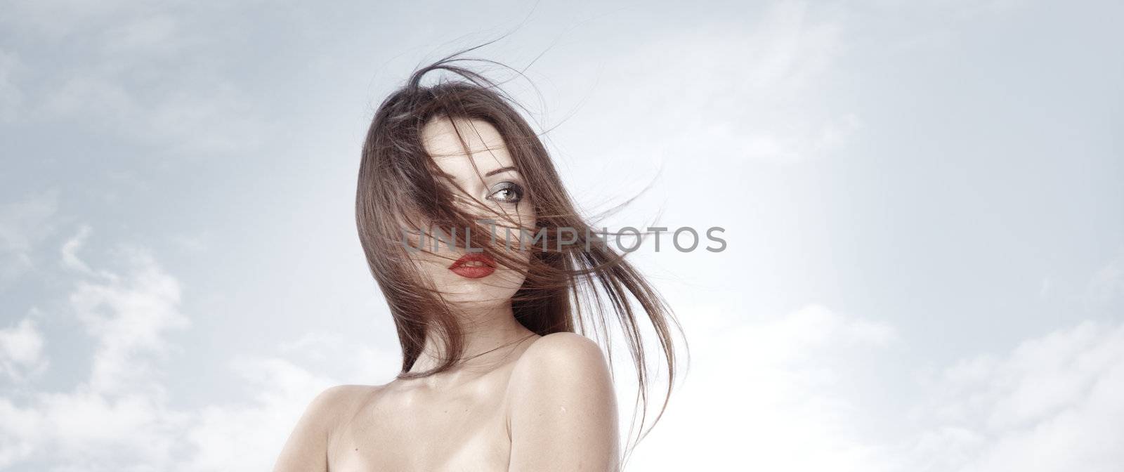 Gothic lady outdoors on a sky background