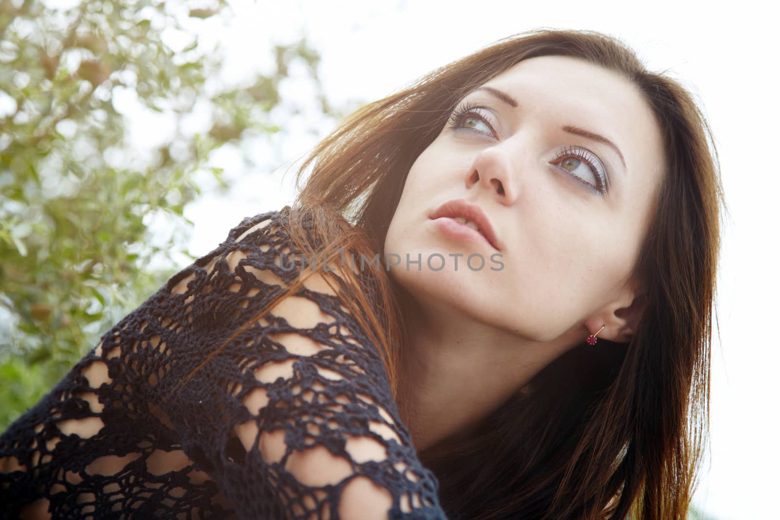Horizontal portrait of the pretty young woman outdoors