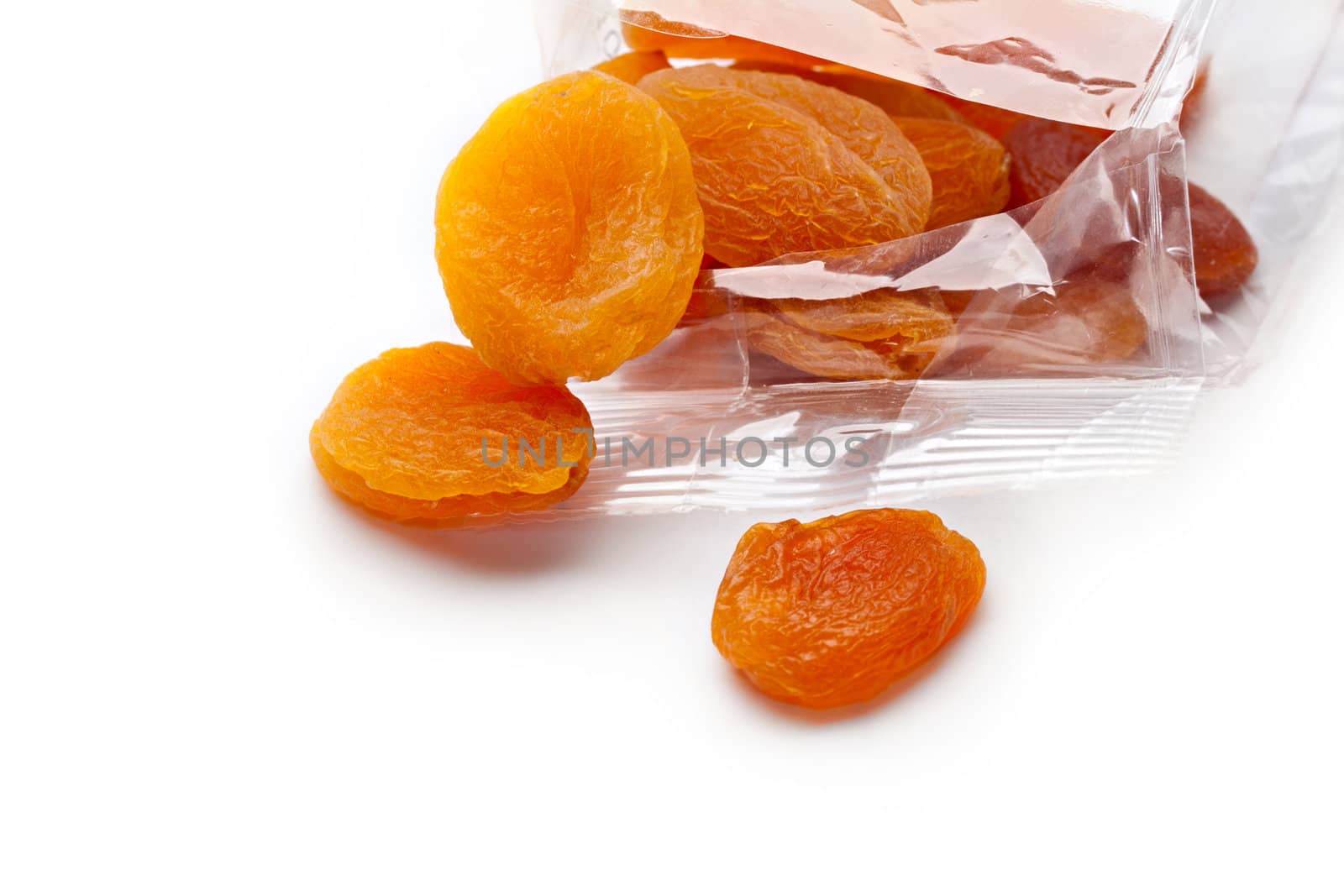 Dried apricots isolated on white background by Garsya