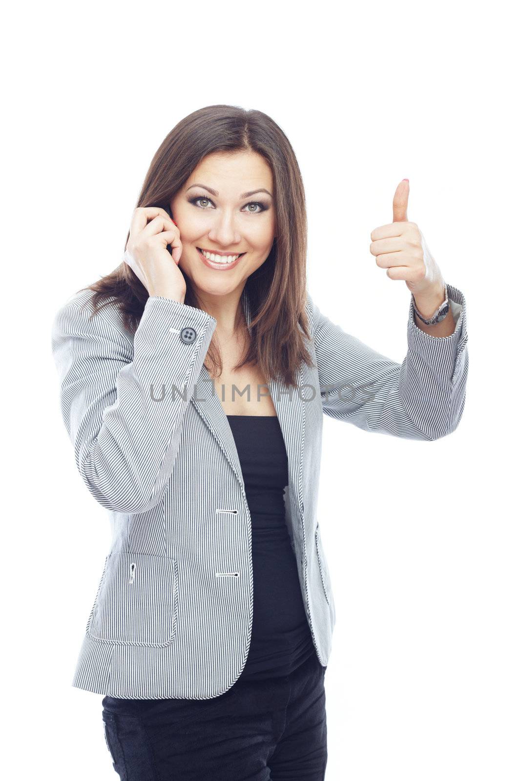 Businesswoman talking by cell phone and making OK sign