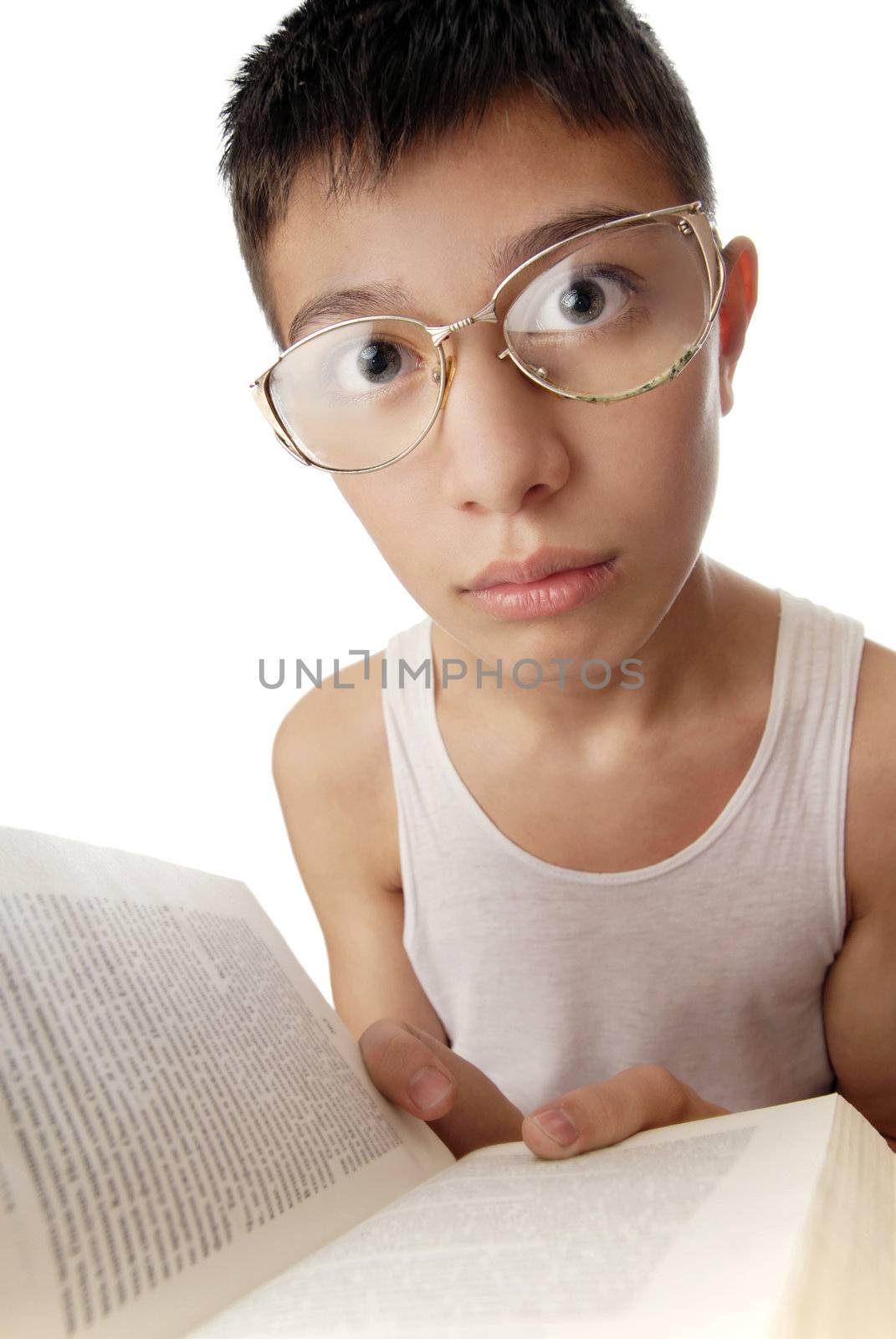 Photo of young boy with a book and spectacles as a symbol of erudition