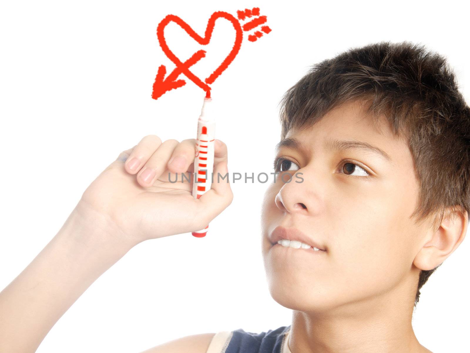 Boy drawing the heart and arrow as a symbols of the love