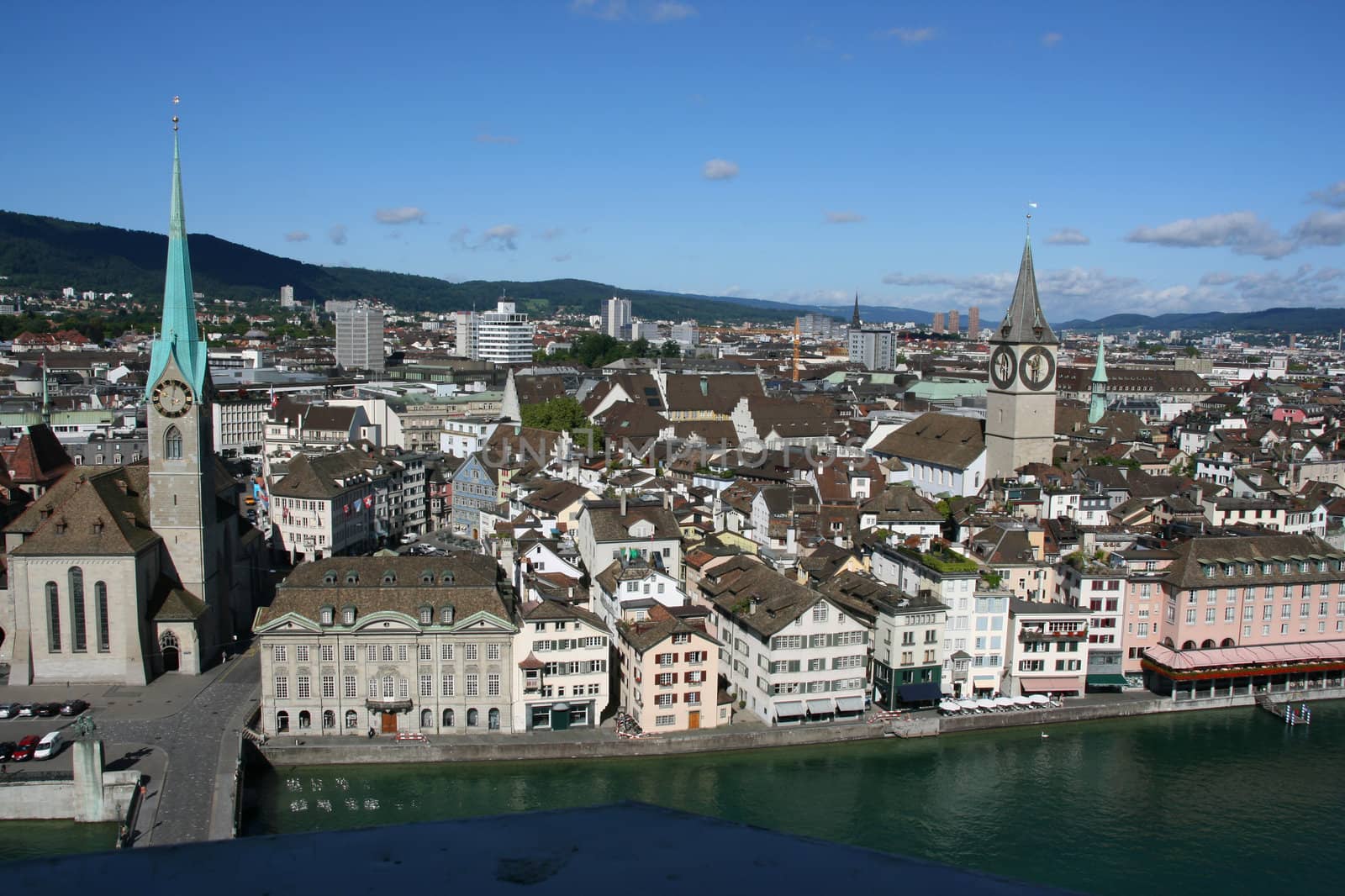 Zurich cityscape. Fraumuenster on the left, St. Peter's Church on the right. Limmat river.