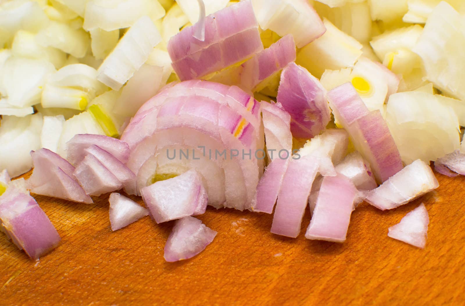 chopped raw onions on board