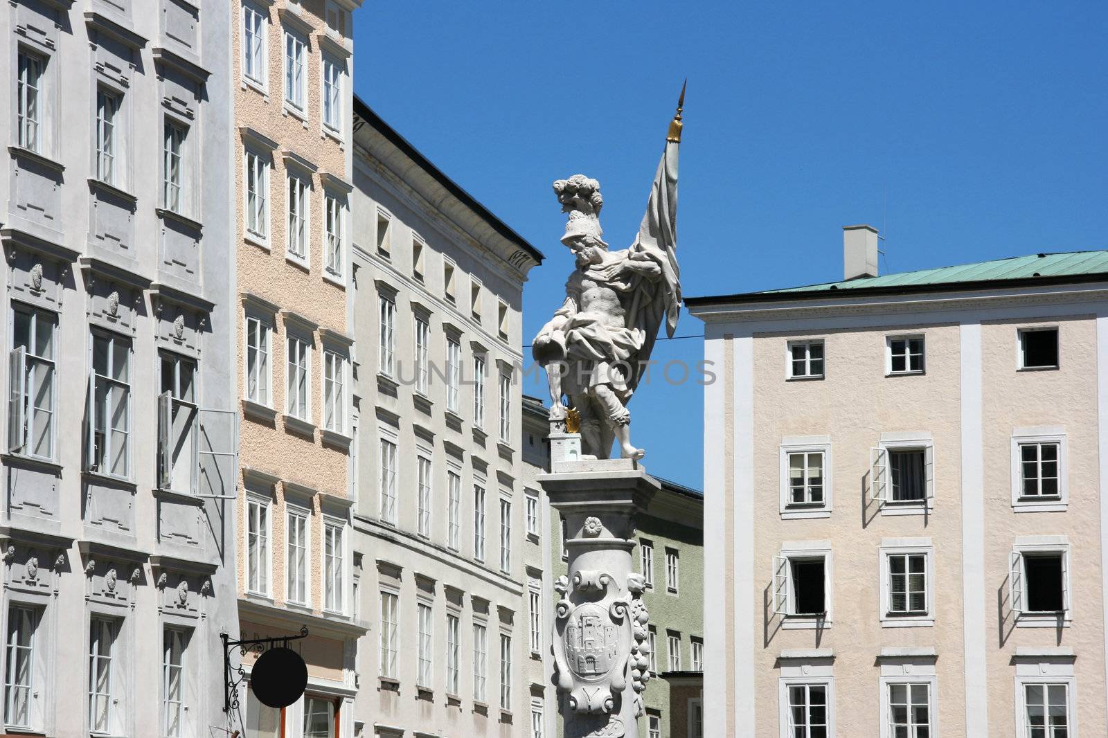 Old town square in Salzburg, Austria. Saint Florian statue.