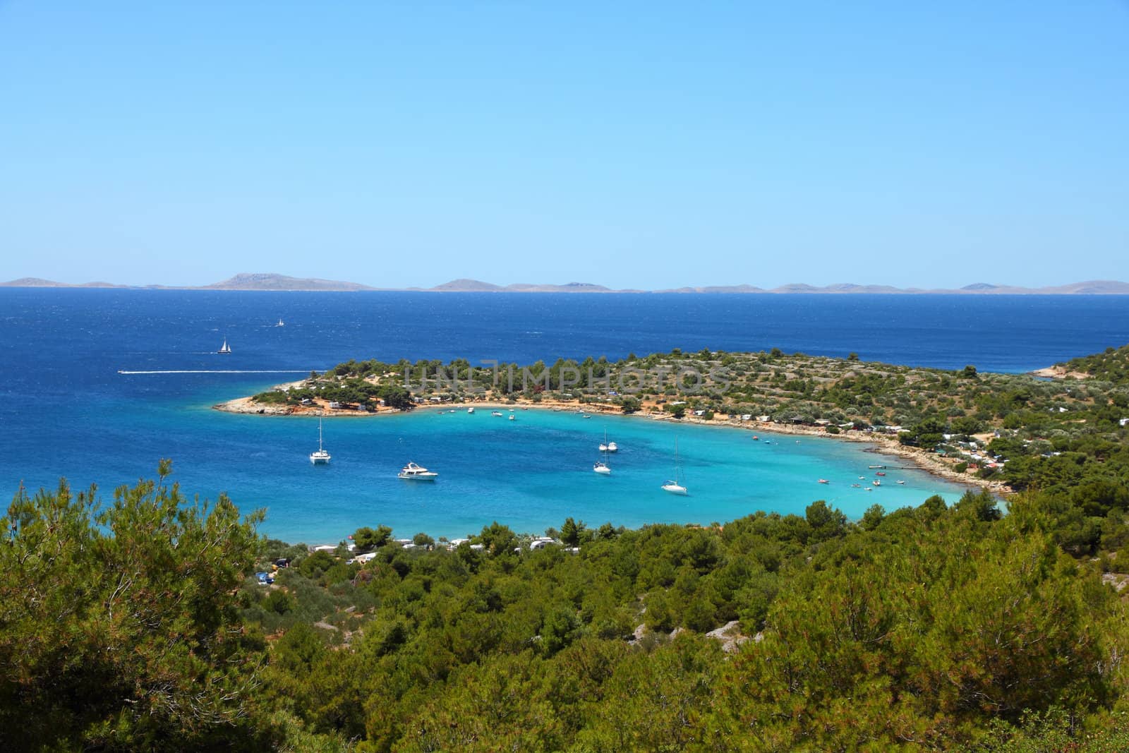 Croatia - beautiful Mediterranean coast landscape in Dalmatia. Murter island beach, Kosirina peninsula - Adriatic Sea. Kornati islands in background.