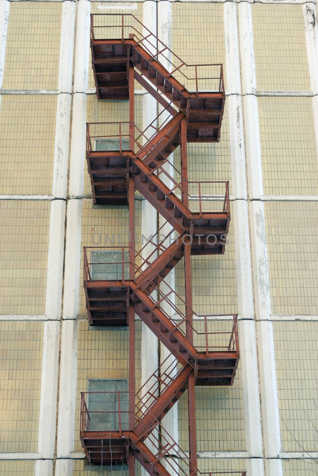 Rusty iron fire escape stairway