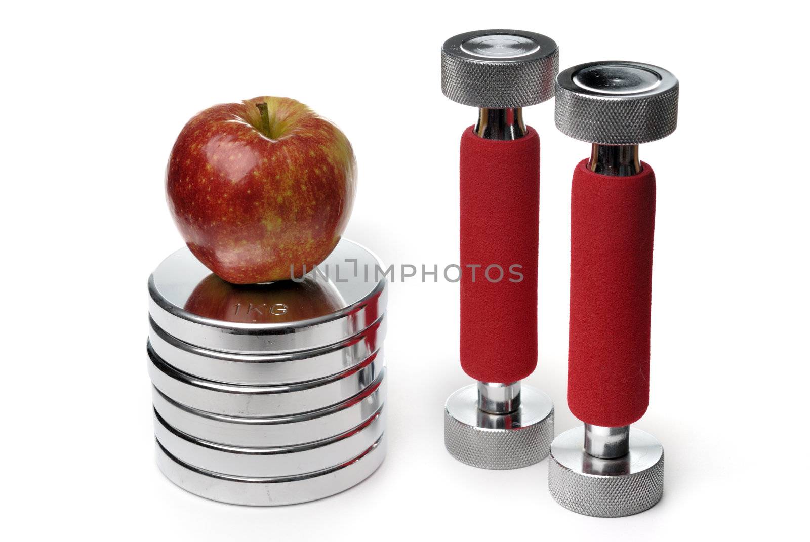 Barbells and apple isolated on white background