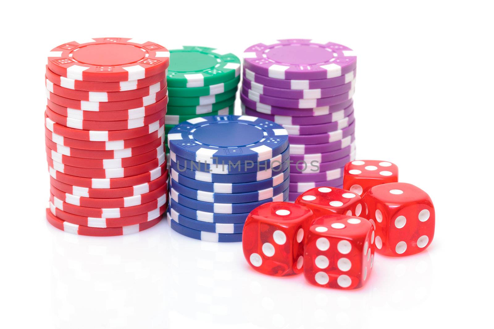 Stacks of Poker Chips with Playing Bones, closeup on white background