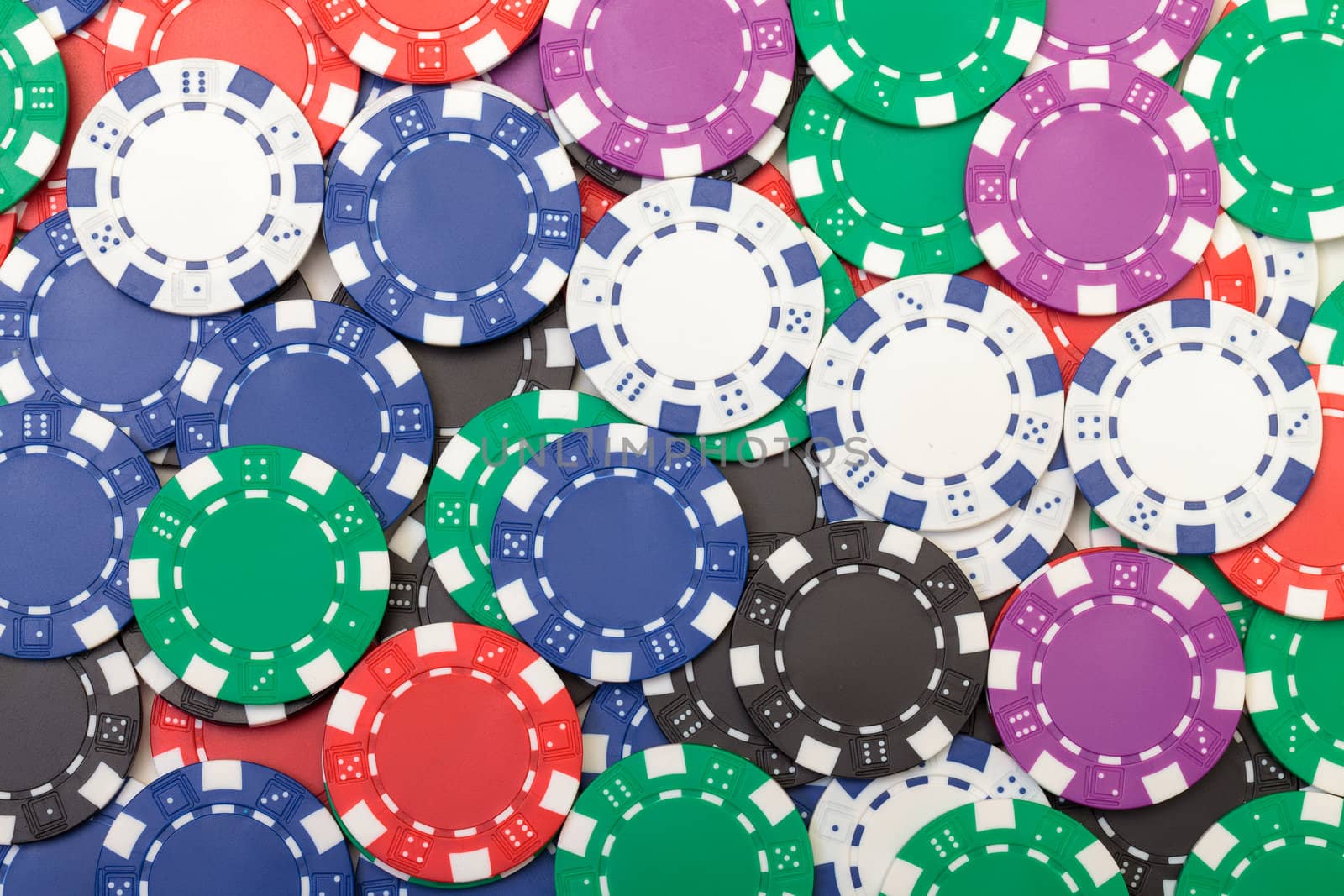 Background from of Multicolored Poker Chips, closeup