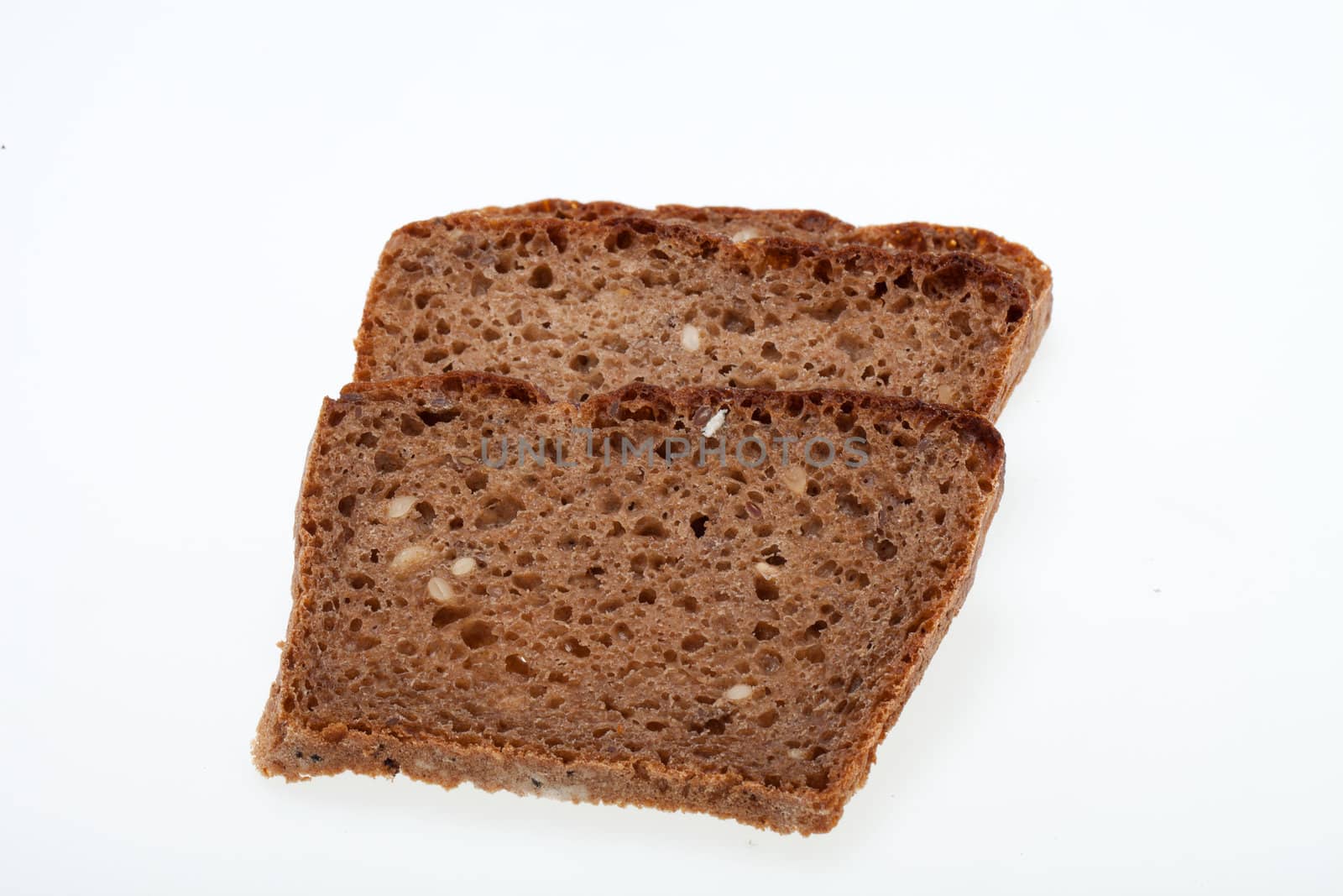 Slices of dark bread isolated over white 