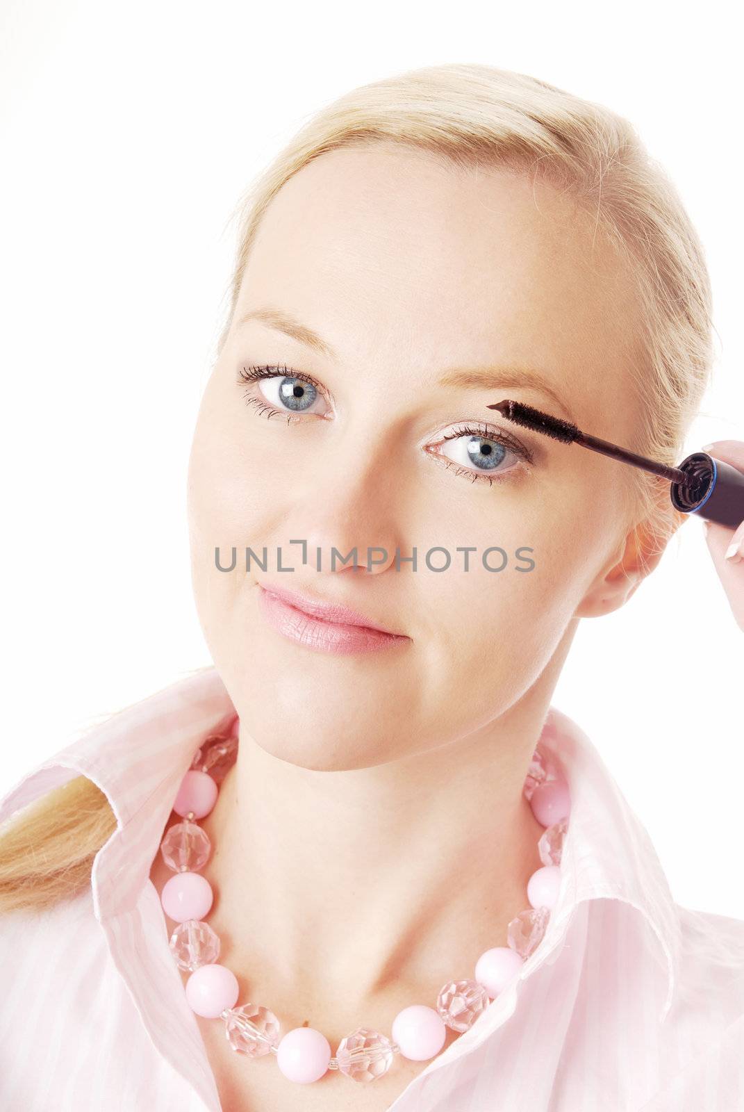 Closeup portrait of the blonde with lash mascara