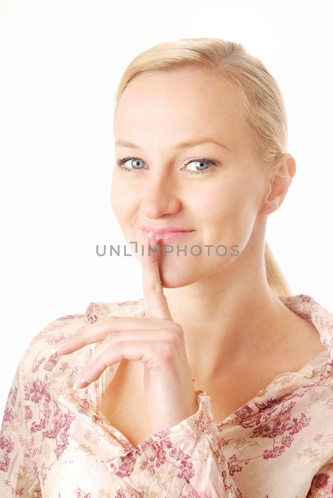 Blonde with finger on her lips as a symbol of secret