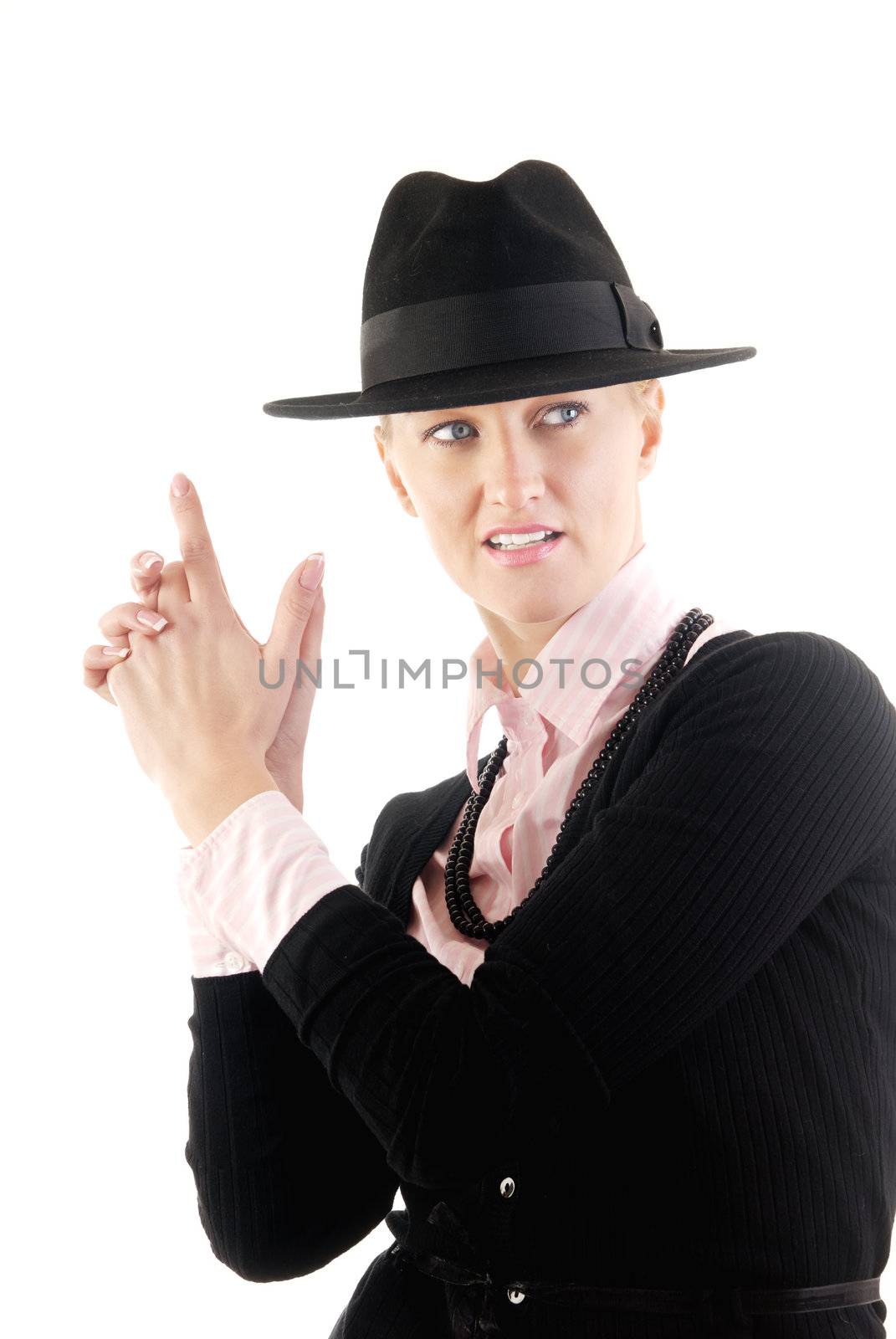 Businesswoman in black hat posing as a gungster or spy