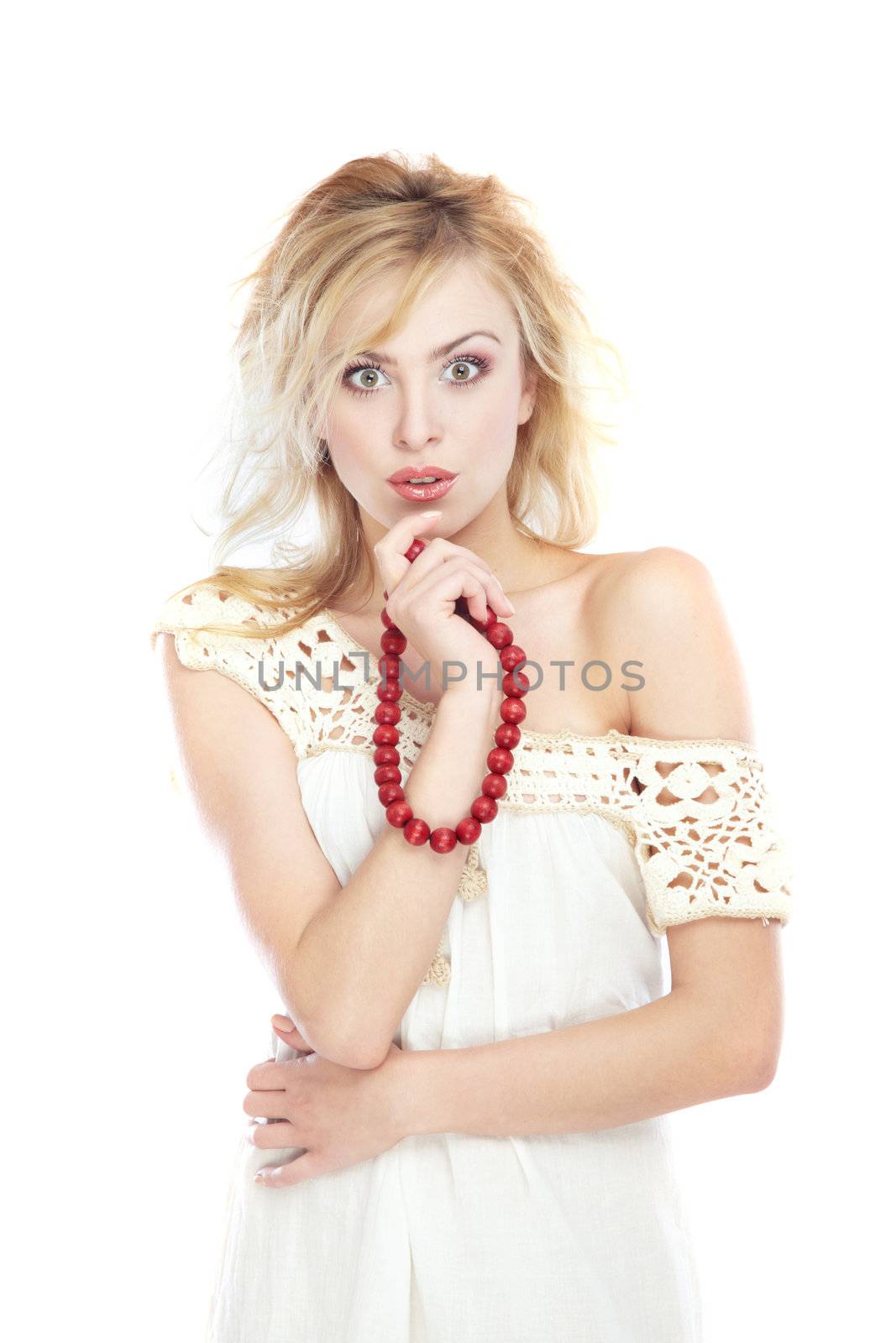 Stylish woman holds red beads on a white background