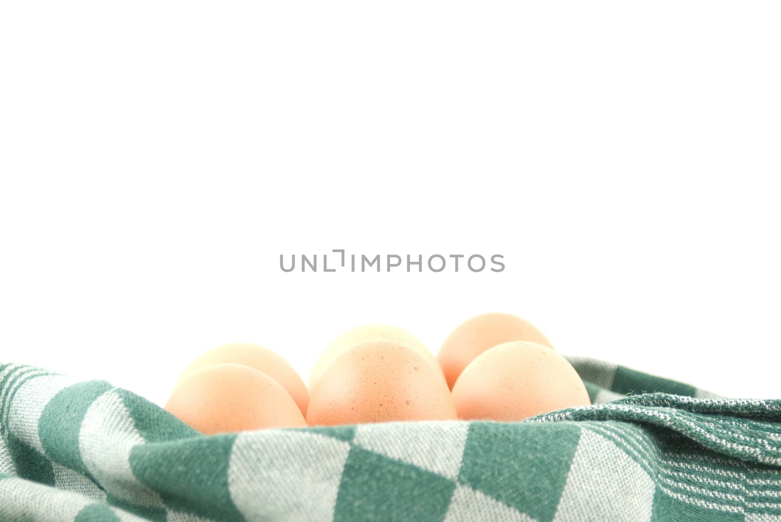 eggs in a wicker basket on white background