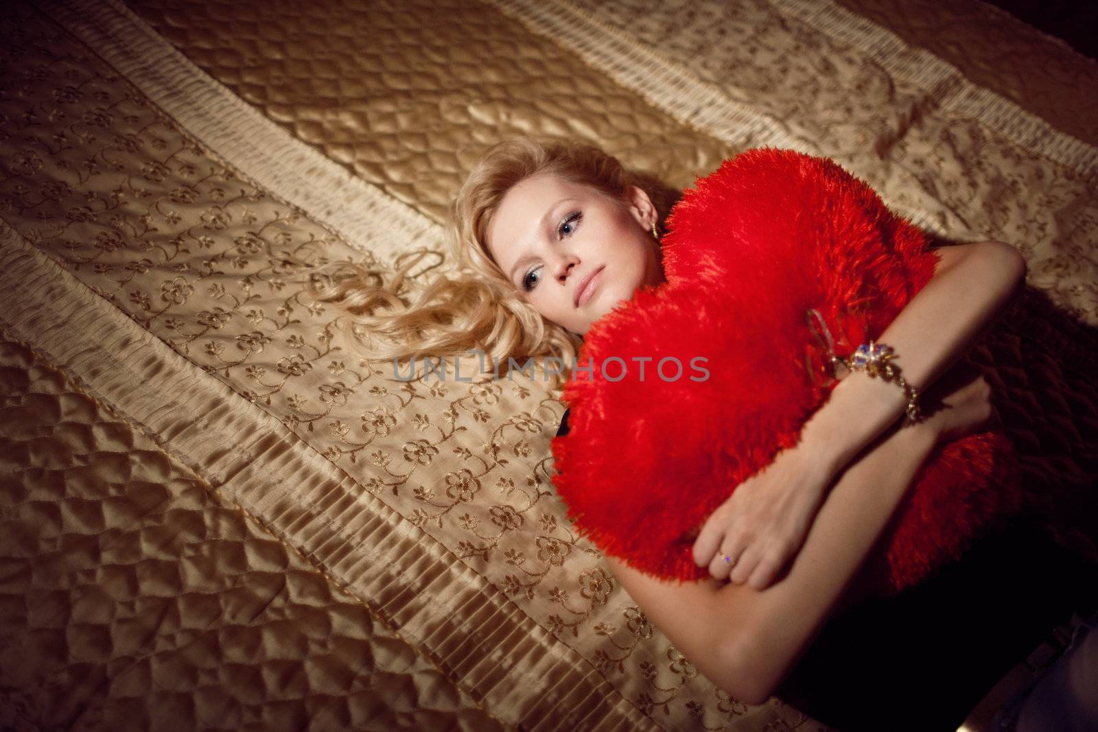 beauty with a red pillow
