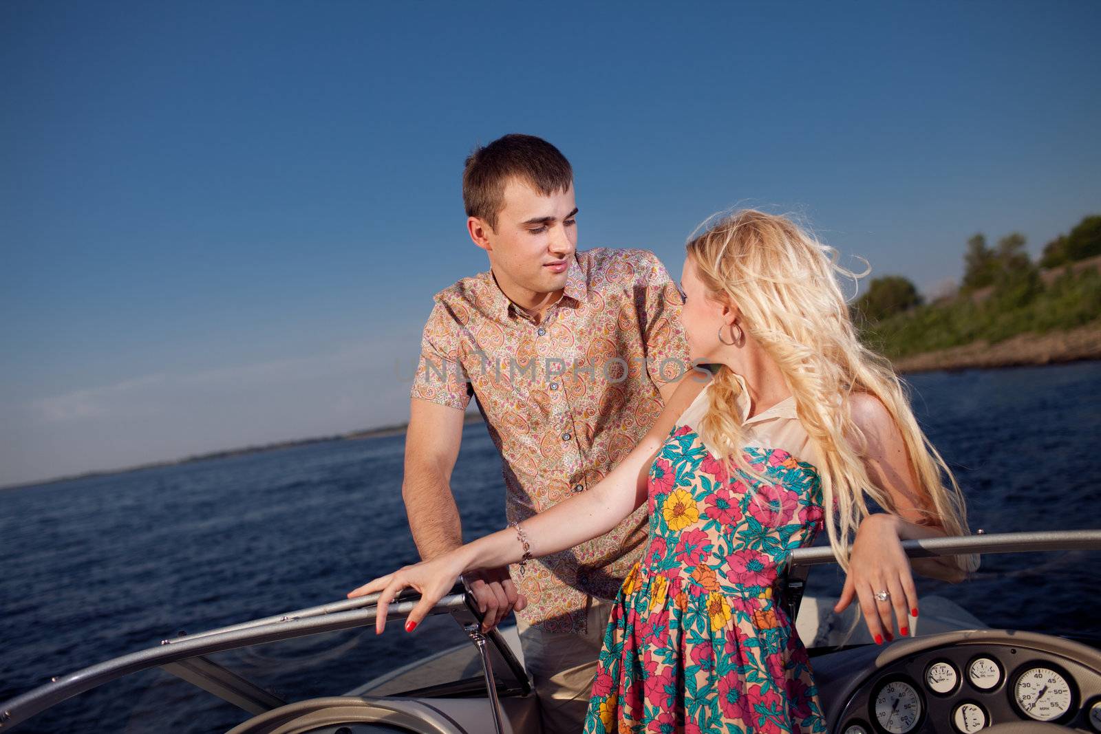 young happy couple on the boat