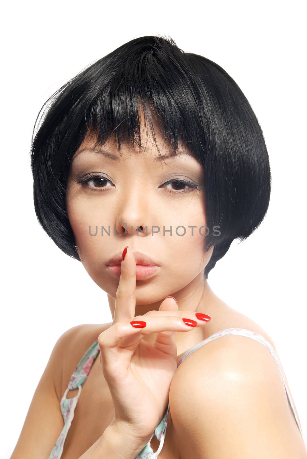 Sensual portrait of the model with finger on her lips