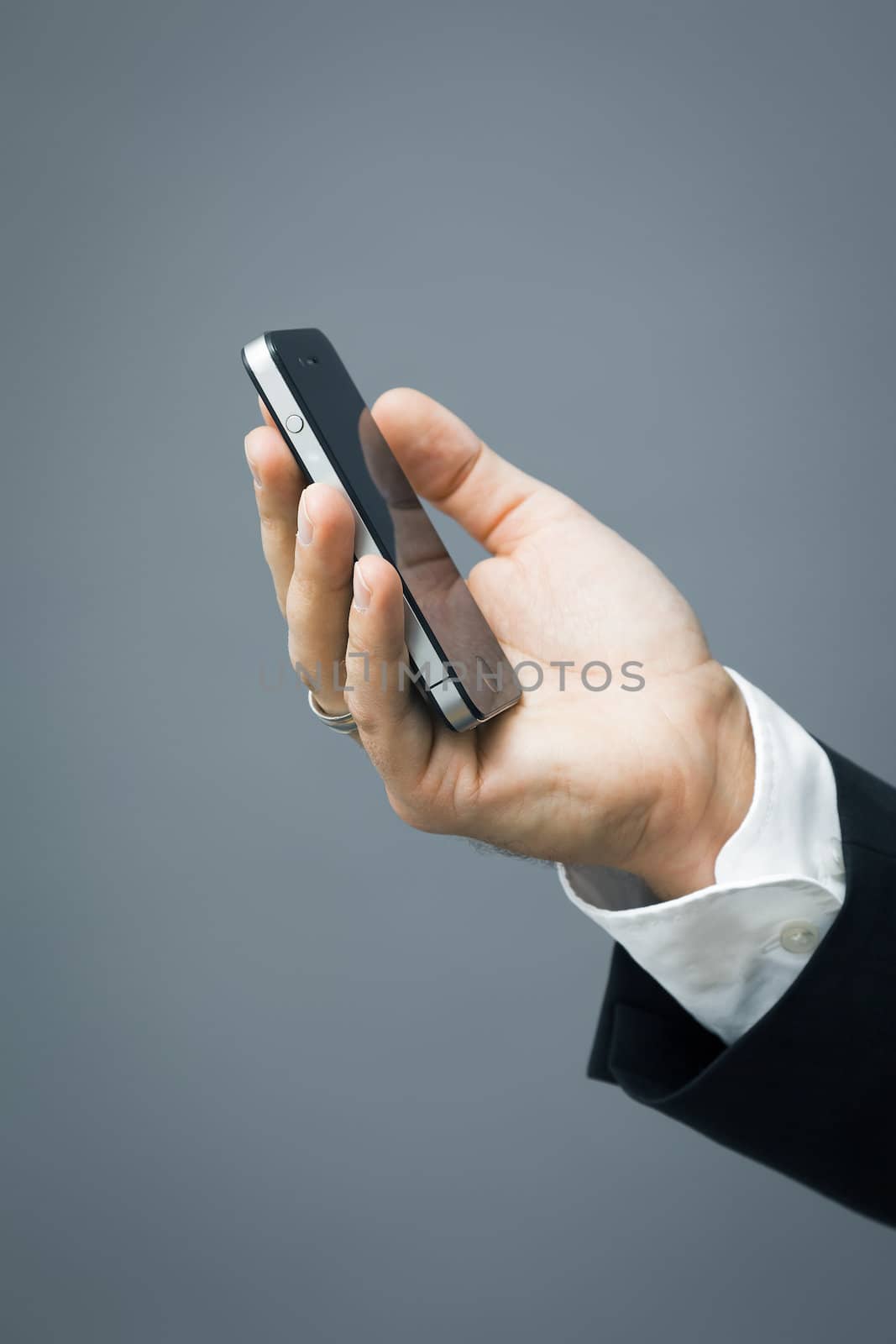 An image of a handsome business man and his mobile phone