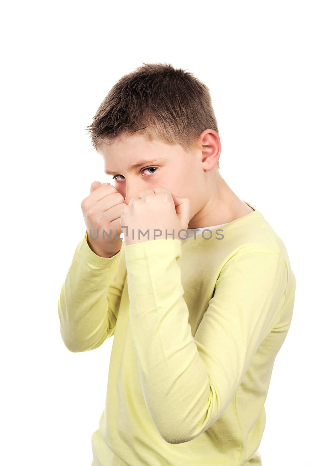 combative young boy in studio