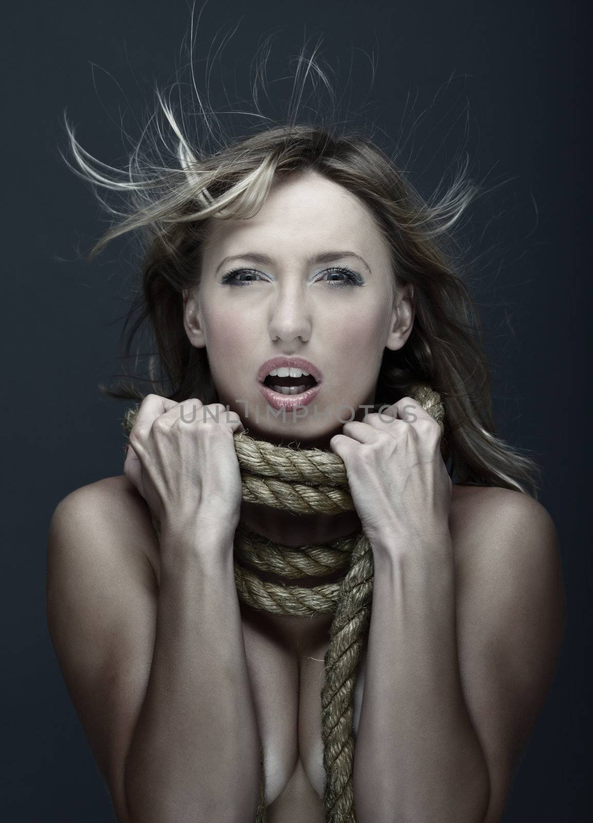 Suffering woman in crisis with terrible rope on her neck