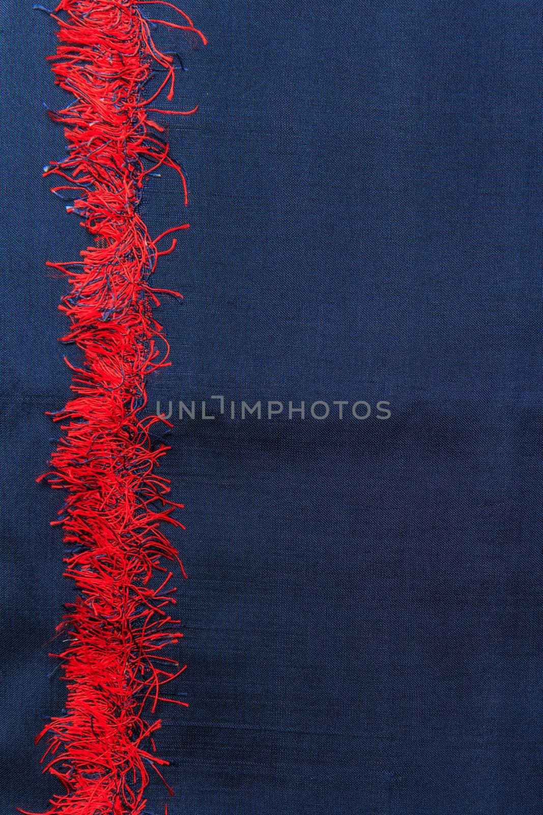 Red strip Thai silk background by bunwit