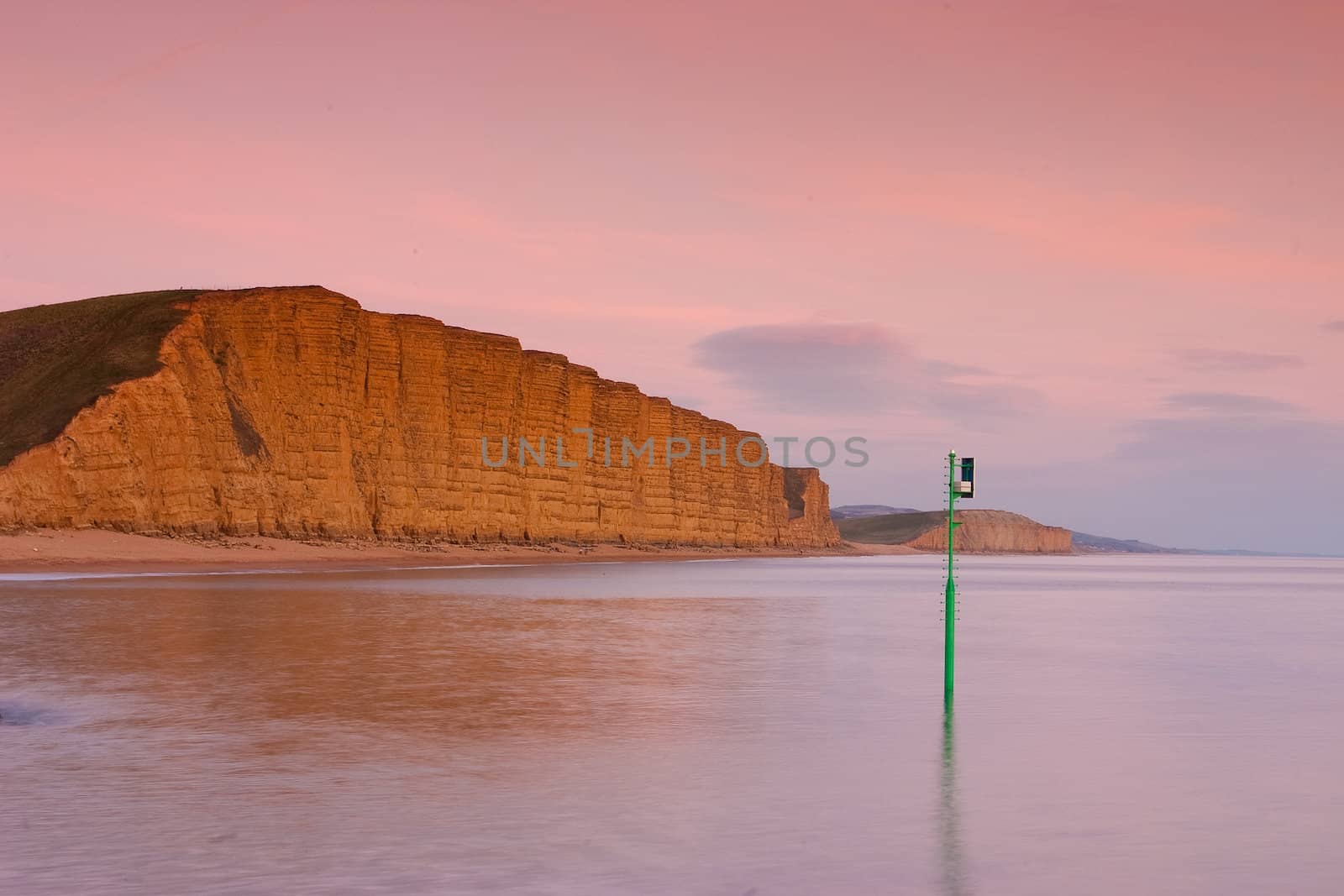 The towering cliffs at West Bay by CaptureLight