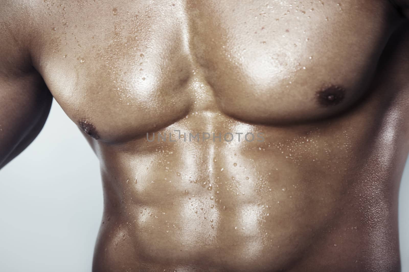 Close-up view on a muscular man's torso