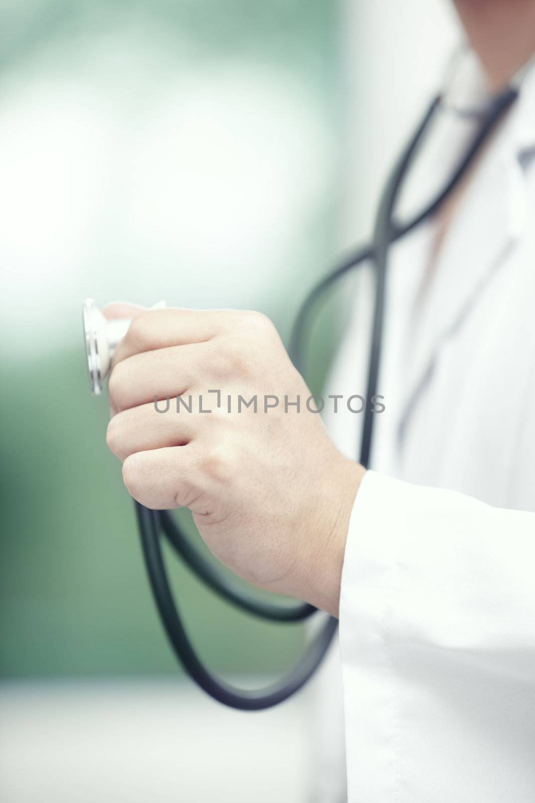 Close-up photo of the doctor hand holding stethoscope