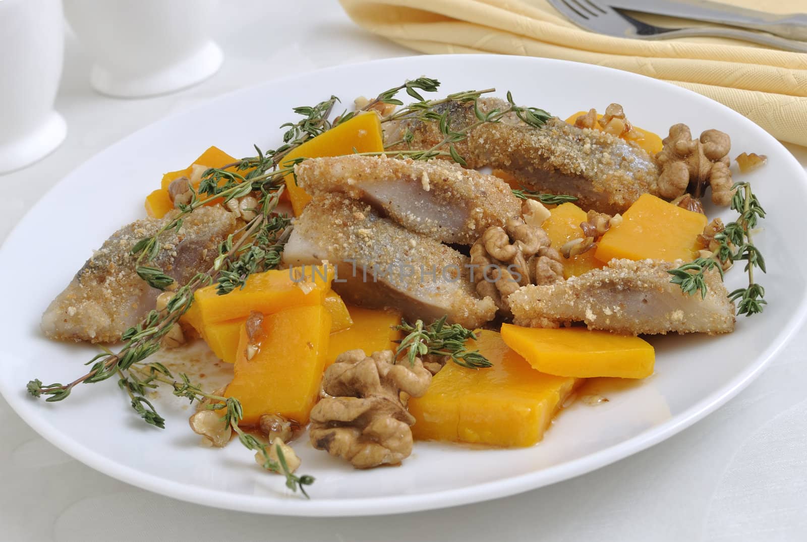 Herring in the pumpkin gratin with nut sauce