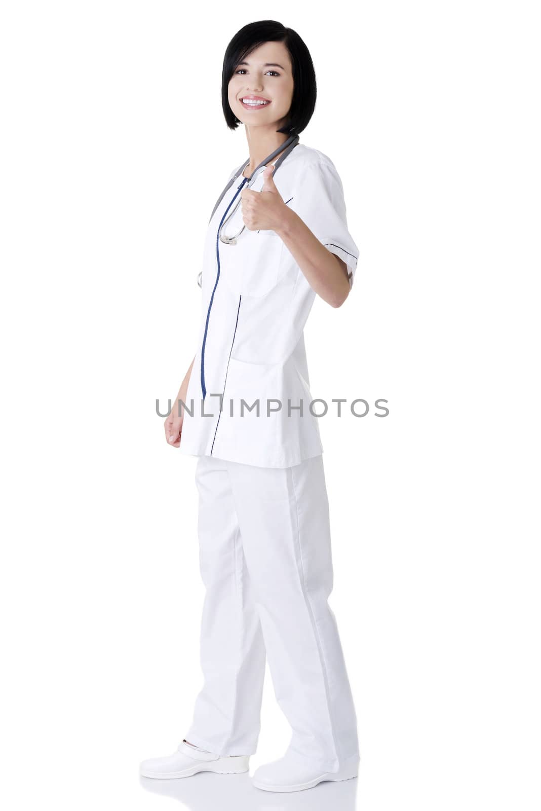 Young female doctor or nurse gesturing OK. Isolated on white.