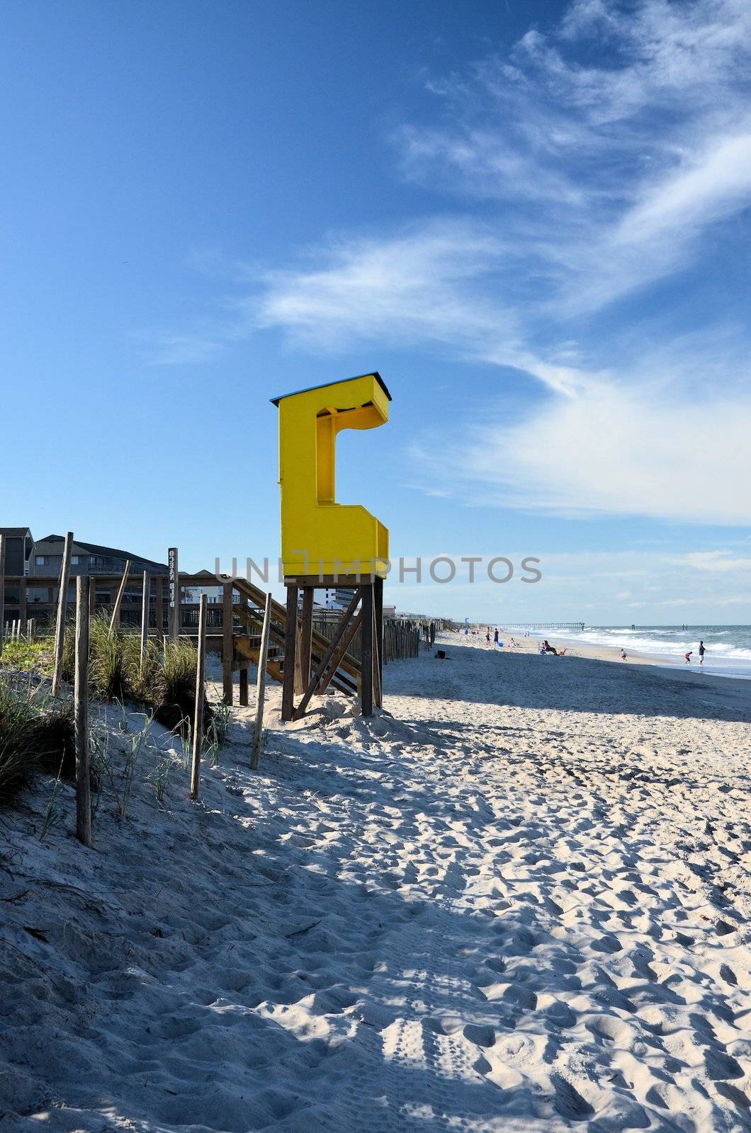 A yellow lifegaurd station at Carolina Beach in North Carolina
