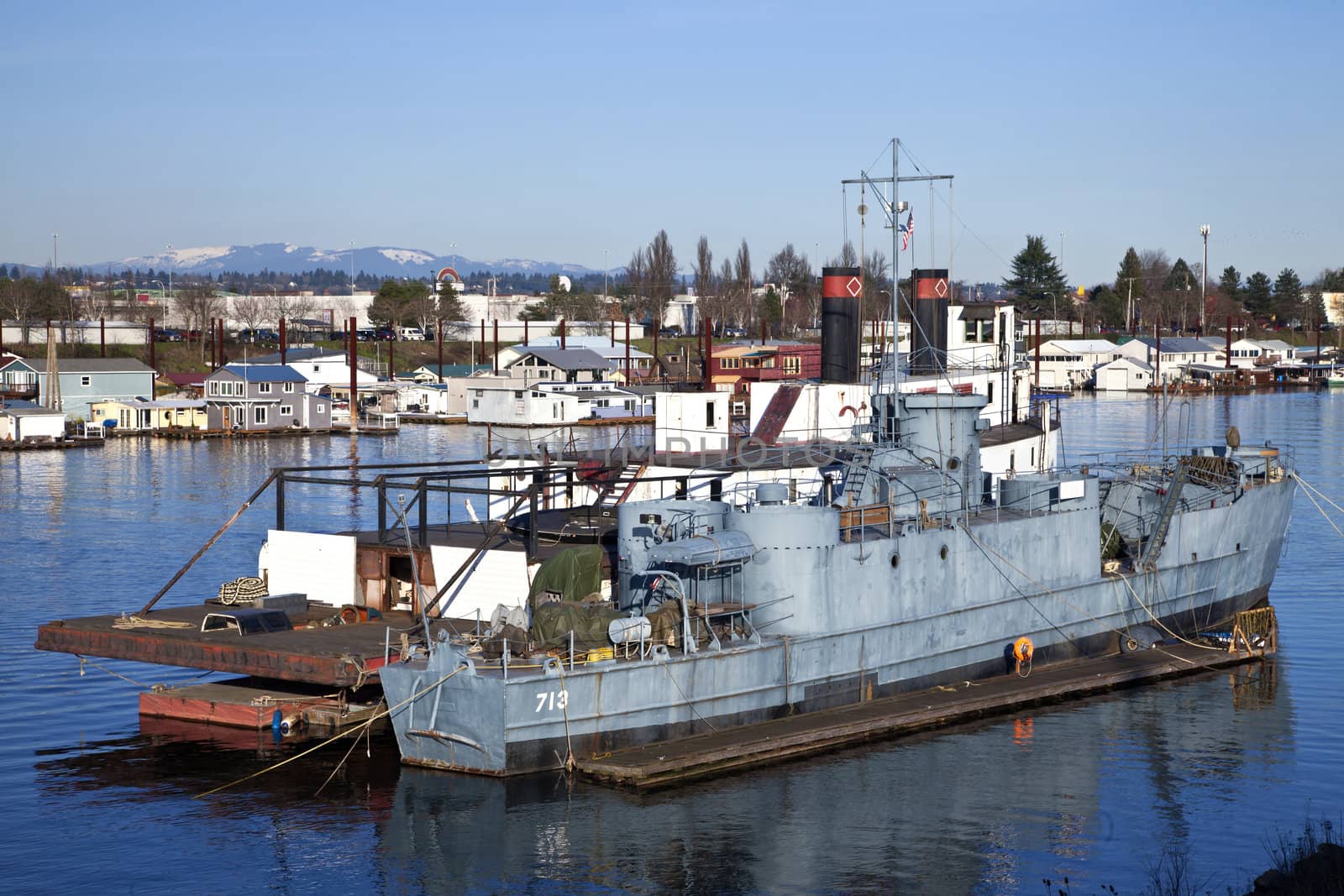 Old vessels moored in a river Portland OR. by Rigucci