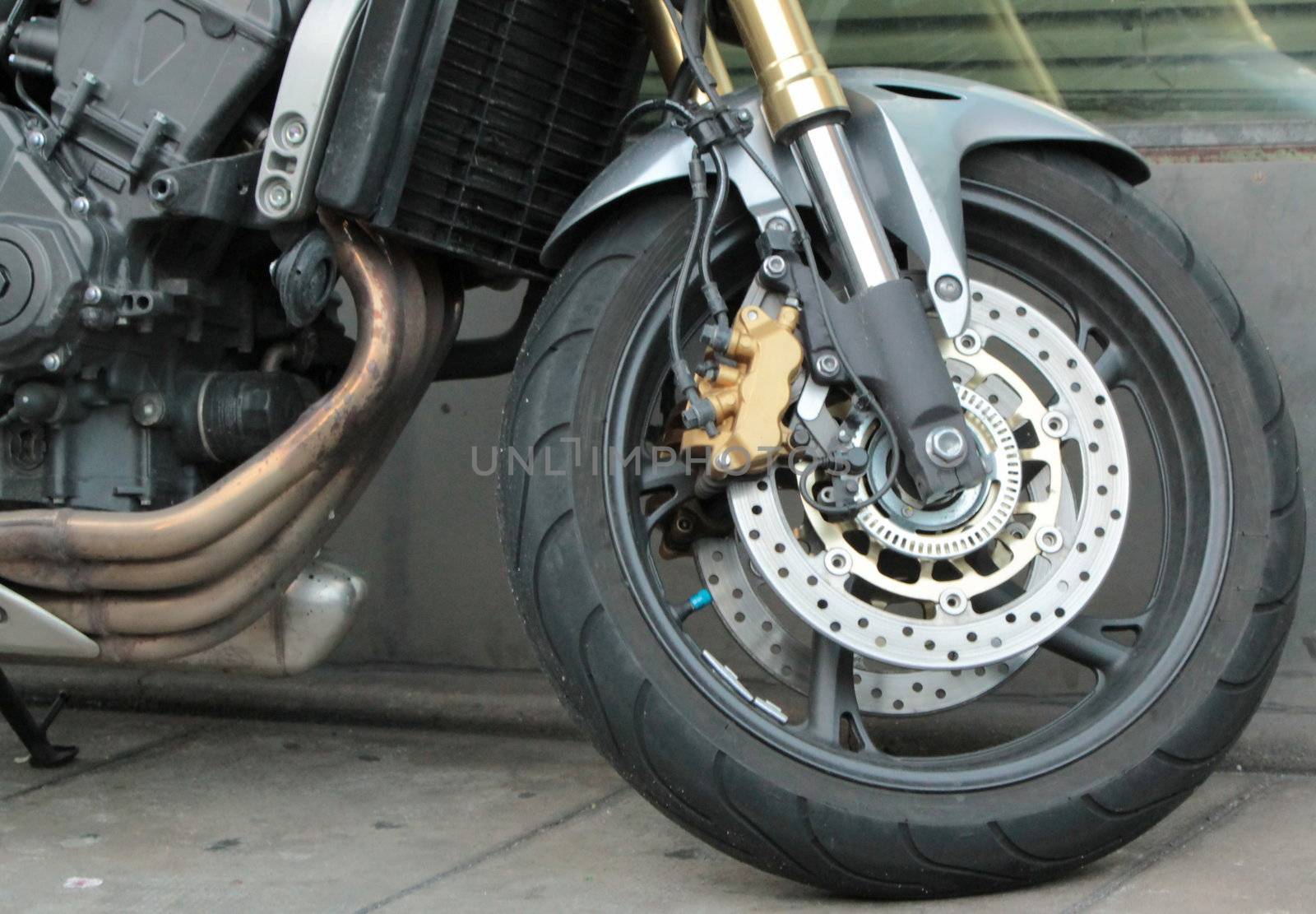 Close up of the front wheel of a motorbike